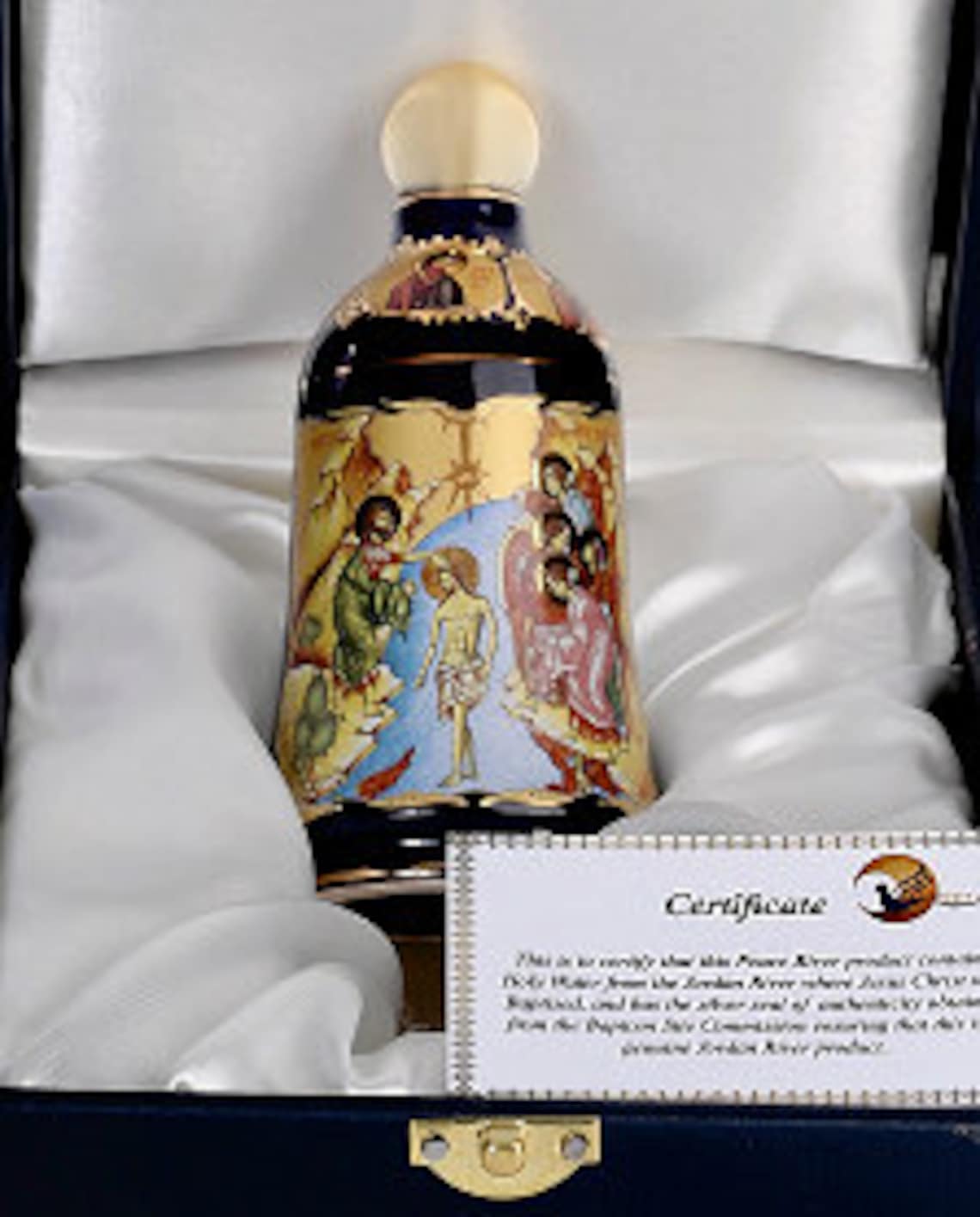Holy Water from the Jordan River where Jesus Christ was Baptized and Blessed contained in a 24K Gold Hand Painted Bottle with Baptism Scene.